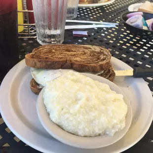 Fried egg sandwich on rye with grits