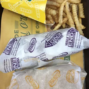 a tray of fries and a bag of chips