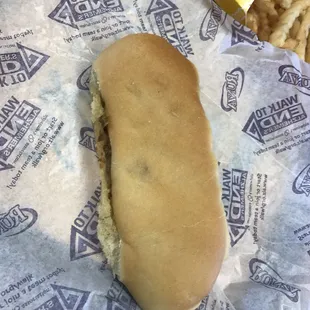 a hot dog on a paper wrapper