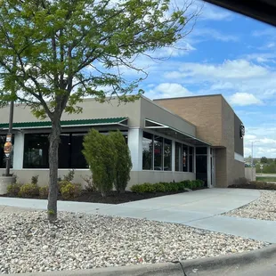a building with a tree in front of it