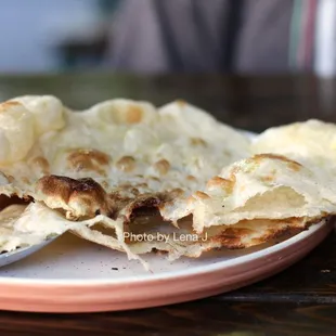 Inside of Naan, ghee, sea salt ($4)