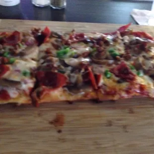 The " Big Z " Flatbread Hot Sausage, Pepperoni, Mushrooms, Onions, Green Peppers &amp; Cheese w/ Marinara.