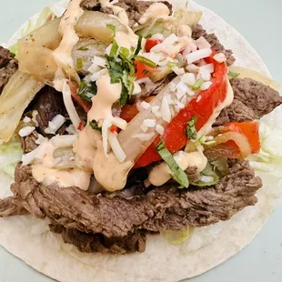 a beef taco on a tortilla