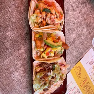 three tacoss on a plate