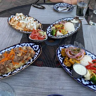 four plates of food on a table