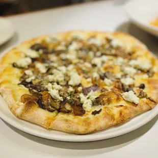 a pizza on a plate on a table