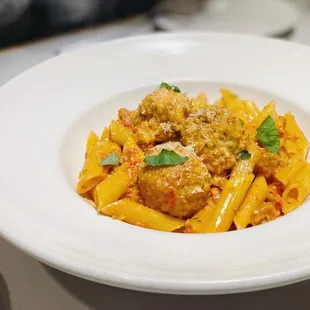 a plate of pasta and meatballs
