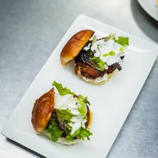 two burgers on a plate