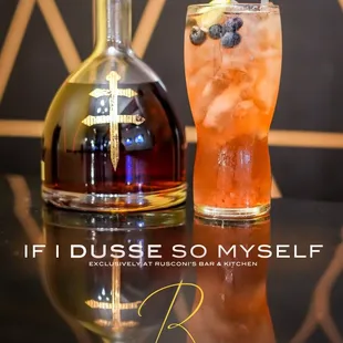 a glass of rum and a bottle of rum