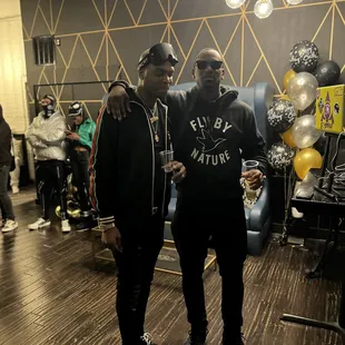 two men standing next to each other