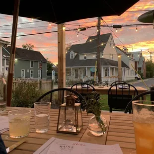 a table with drinks and menus on it