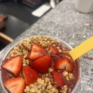 strawberries and granola in a bowl