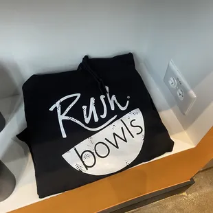 a black t - shirt with the word rush bowls printed on it