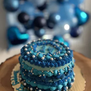 a blue and white birthday cake