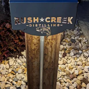 a sign for rush creek distilling