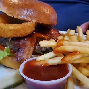 a burger and fries on a plate