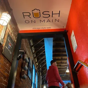 a woman and a child walking down the stairs