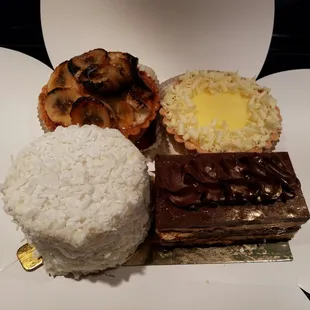 Caramelized coconut cake w/cream cheese, brûlée banana cream tart, citron tart &amp; opera cake