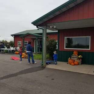 a woman and a child standing in front of a building