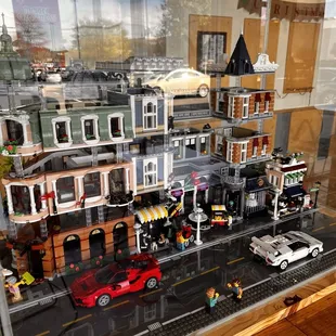 Adorable LEGO village, showcased in a central case