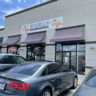 cars parked in front of the restaurant