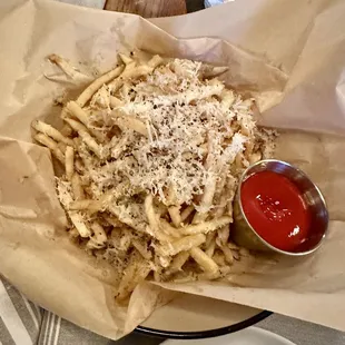 Cacio e pepe fries, topped with pecorino.