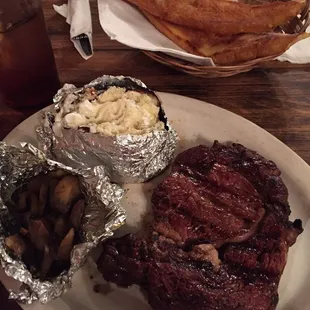12 oz. ribeye, baked potato, &amp; sautéed mushrooms.