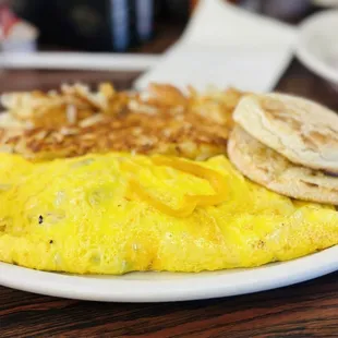 an omelet with a side of hash browns