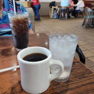 a cup of coffee and a glass of water