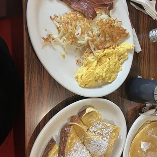 a breakfast of pancakes, eggs, bacon and pancakes