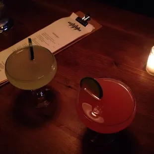 two cocktails on a wooden table