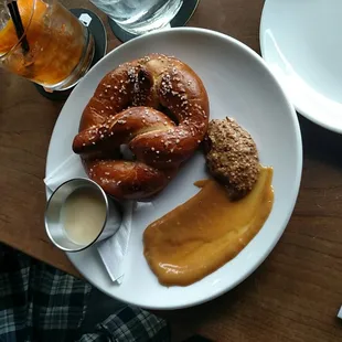 pretzel with mustards and Beecher&apos;s beer cheese