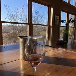 a glass of wine on a table