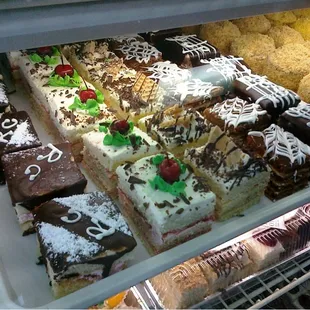 a variety of pastries in a display case