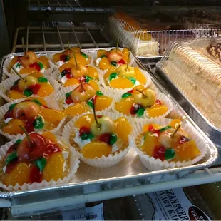 a variety of desserts in a display case