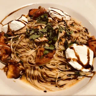 Pasta Caprese with grilled chicken was beautifully presented- the photo doesn&apos;t really do it Justice- and it was delicious.