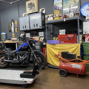 In the back a garage to work on their motorcycles.