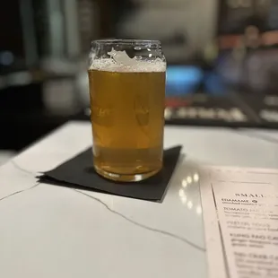 a glass of beer on a table