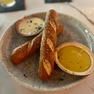 Pretzel appetizer with beer cheese and tasty mustard
