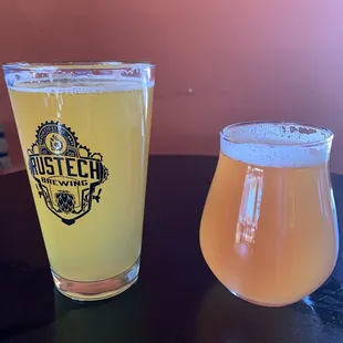 a glass of beer next to a glass of beer