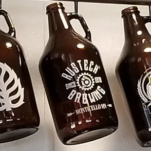 a row of beer bottles hanging on a wall