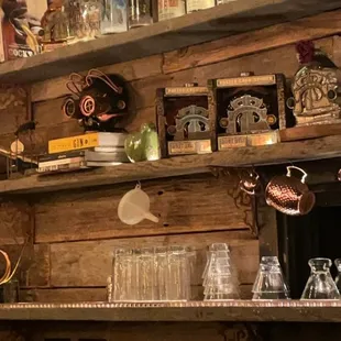 shelves filled with bottles and glasses
