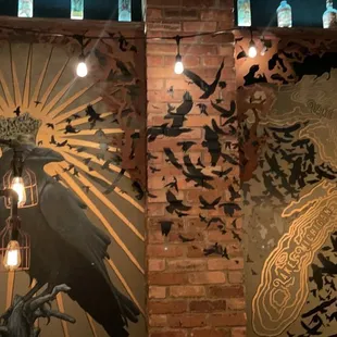 a mural of a woman and a crow