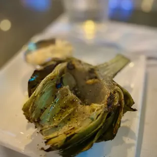 HH Snack: Grilled Artichoke Half $4.95 Topped with fresh cracked pepper and EVOO served w/ lemon garlic aioli