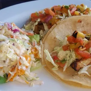 Mahi Mahi fish tacos with coleslaw.