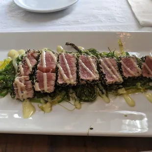 Sesame encrusted tuna w seaweed salad and wasabi cucumber sauce