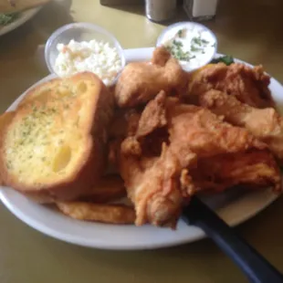 a plate of fried chicken and bread