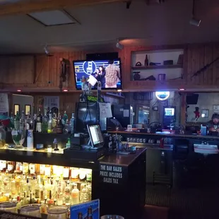 a bar with a large screen tv