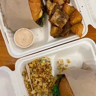two trays of food on a table
