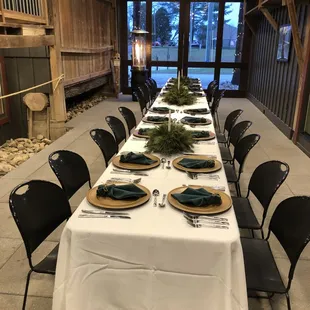 a long table set with place settings
